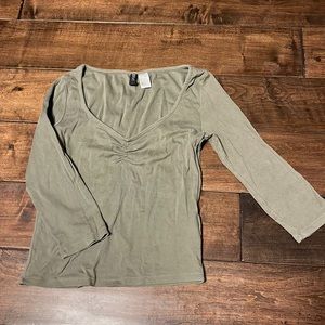 Light green quarter sleeve top.